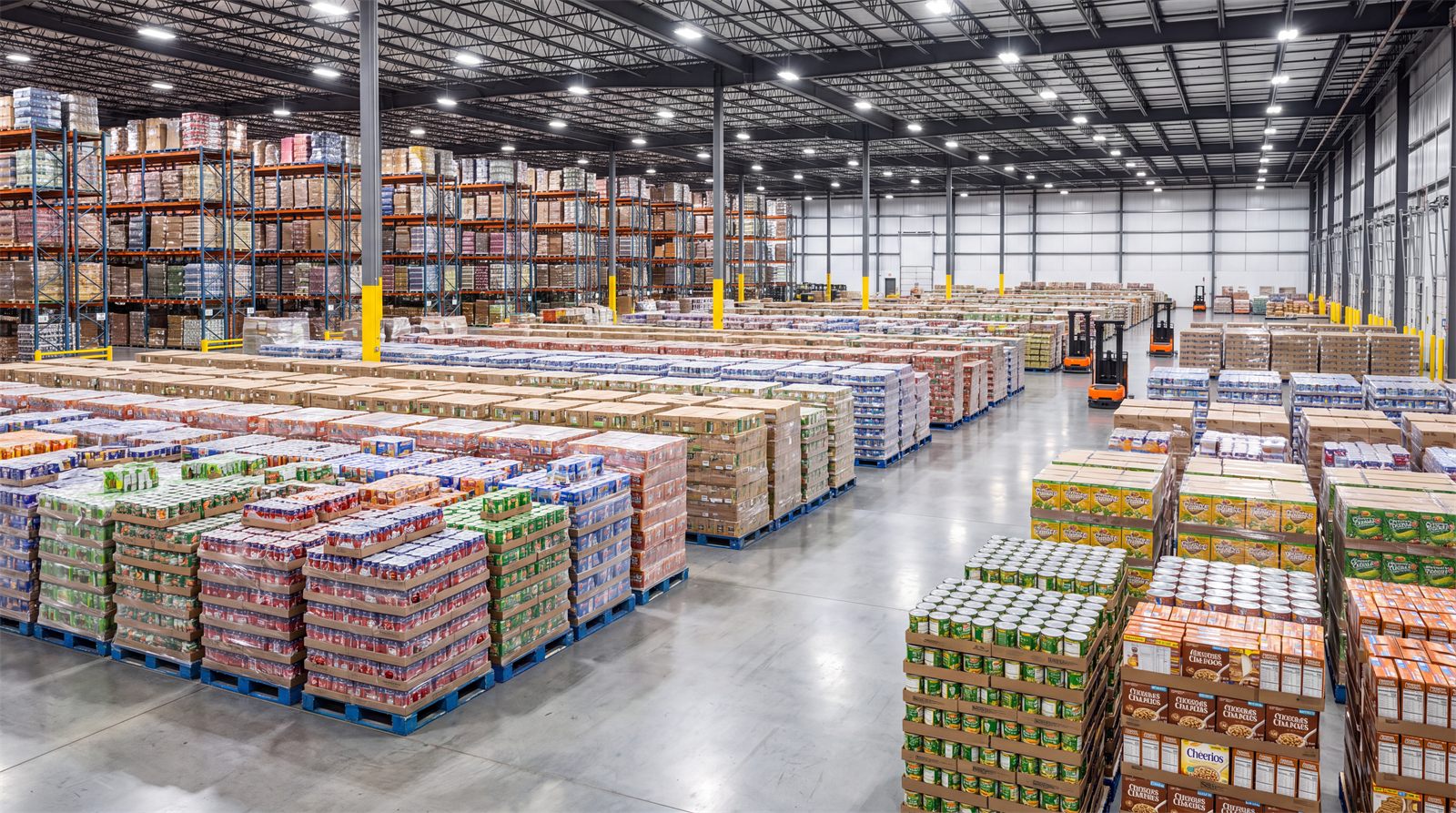 Pallets of packaged food and beverage products staged in a distribution warehouse